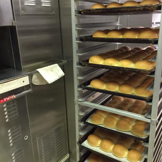 metal trays of recently baked buns